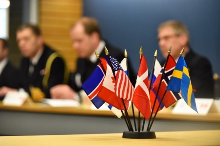 Flags of member nations are displayed during the Arctic Coast Guard Forum (ACGF)