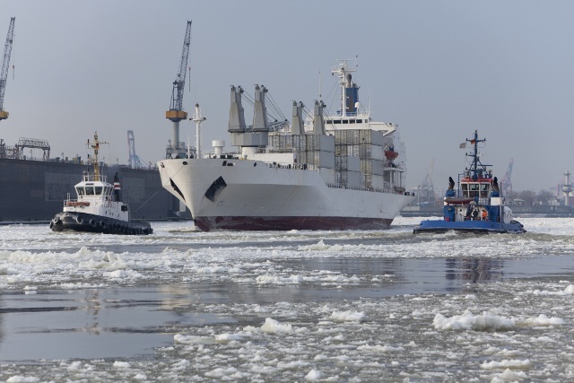 freighter sailing in icy water