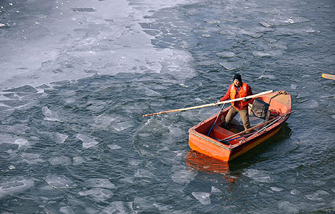 A man works in a frozen river in Taiyuan, Shanxi province